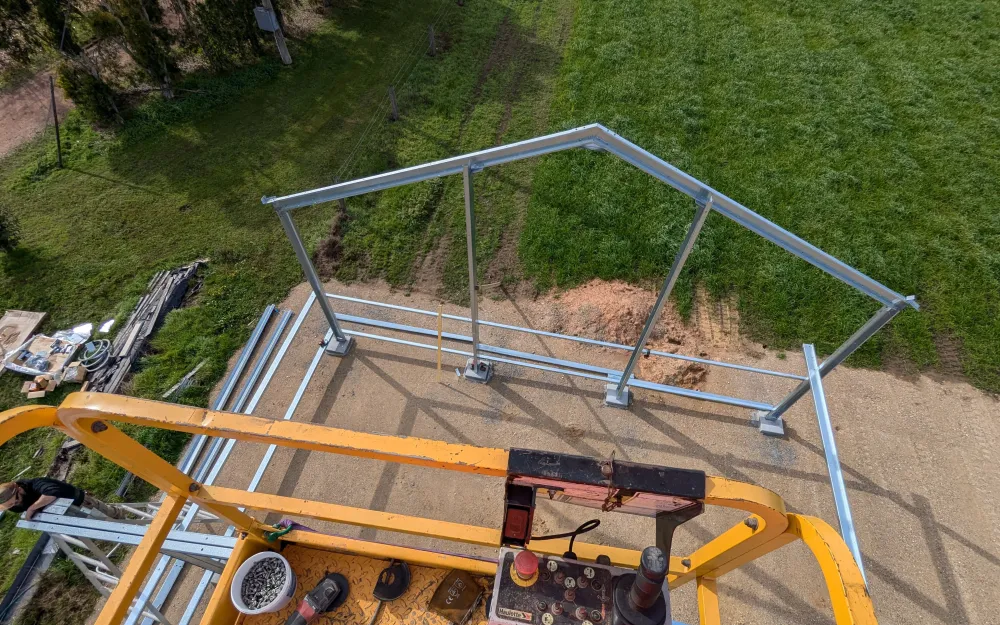 Steel frame going up on a construction site, seen from the basket of a boom lift